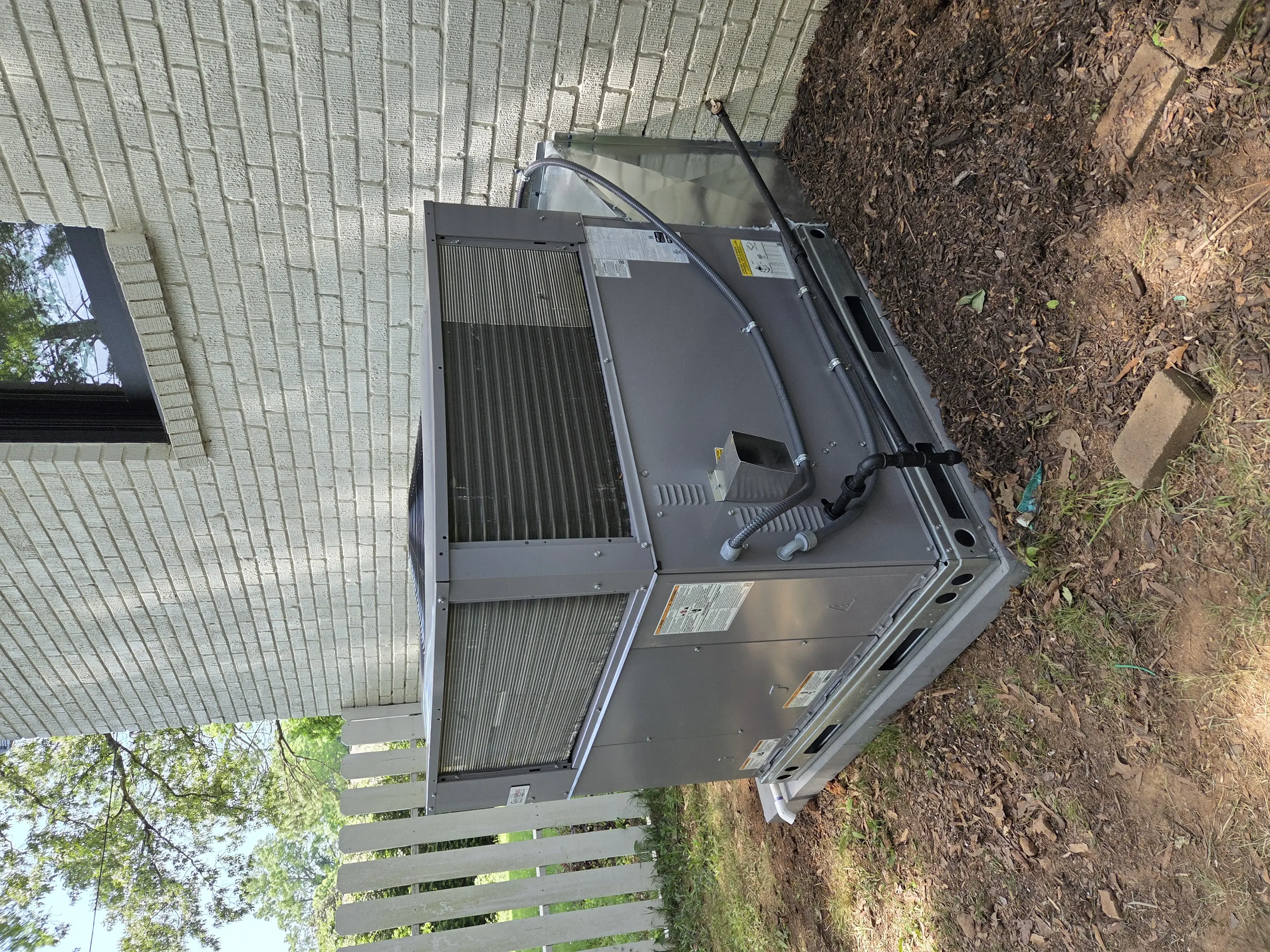 New HVAC equipment installation at a Charlotte-area home — heat pump vs. gas furnace comparison